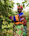 A woman from the Ejo Heza co-op picking coffee cherries in Rwanda